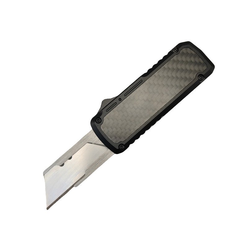 Black carbon fibre handle box cutter close-up